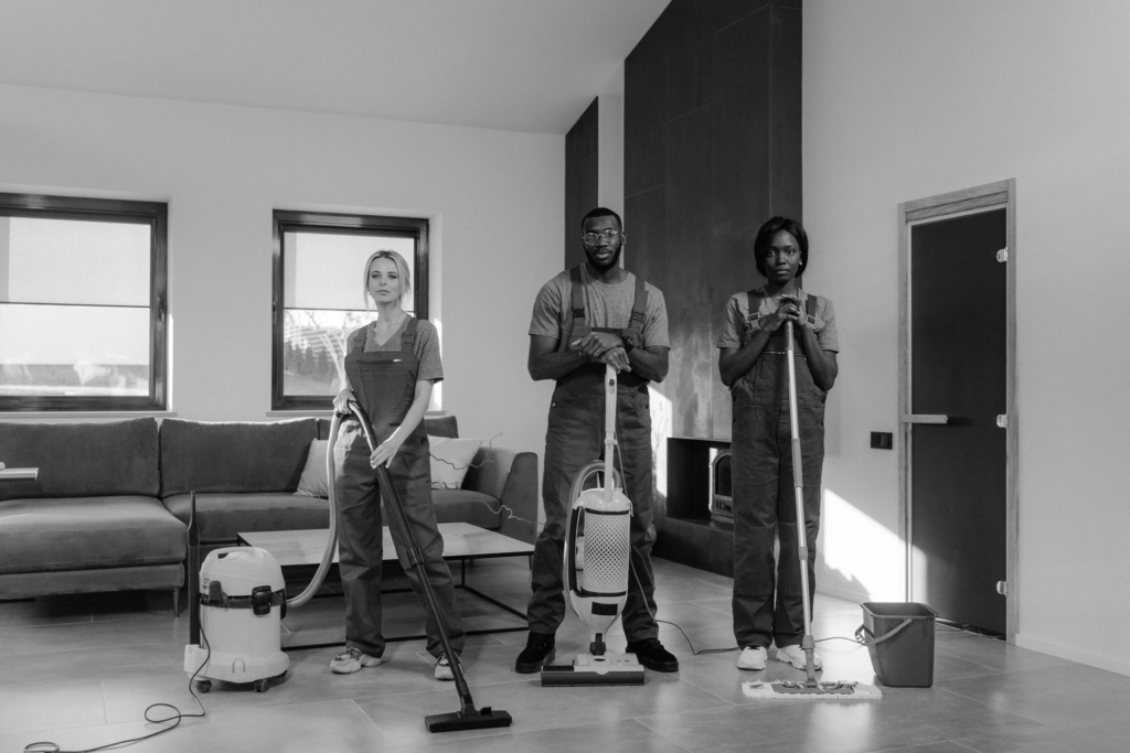 Professional commercial cleaner scrubbing a polished office lobby floor in a Maine business facility at the start of September
