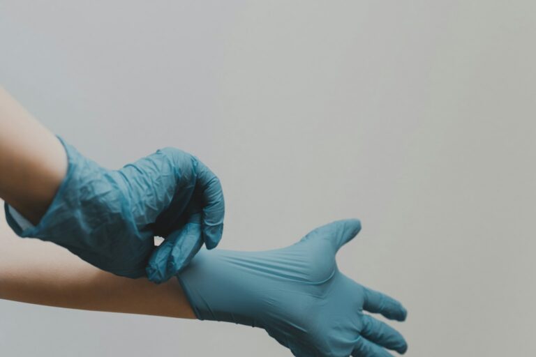 Professional cleaner disinfecting high-touch office surfaces in Maine to prevent cold and flu season spread